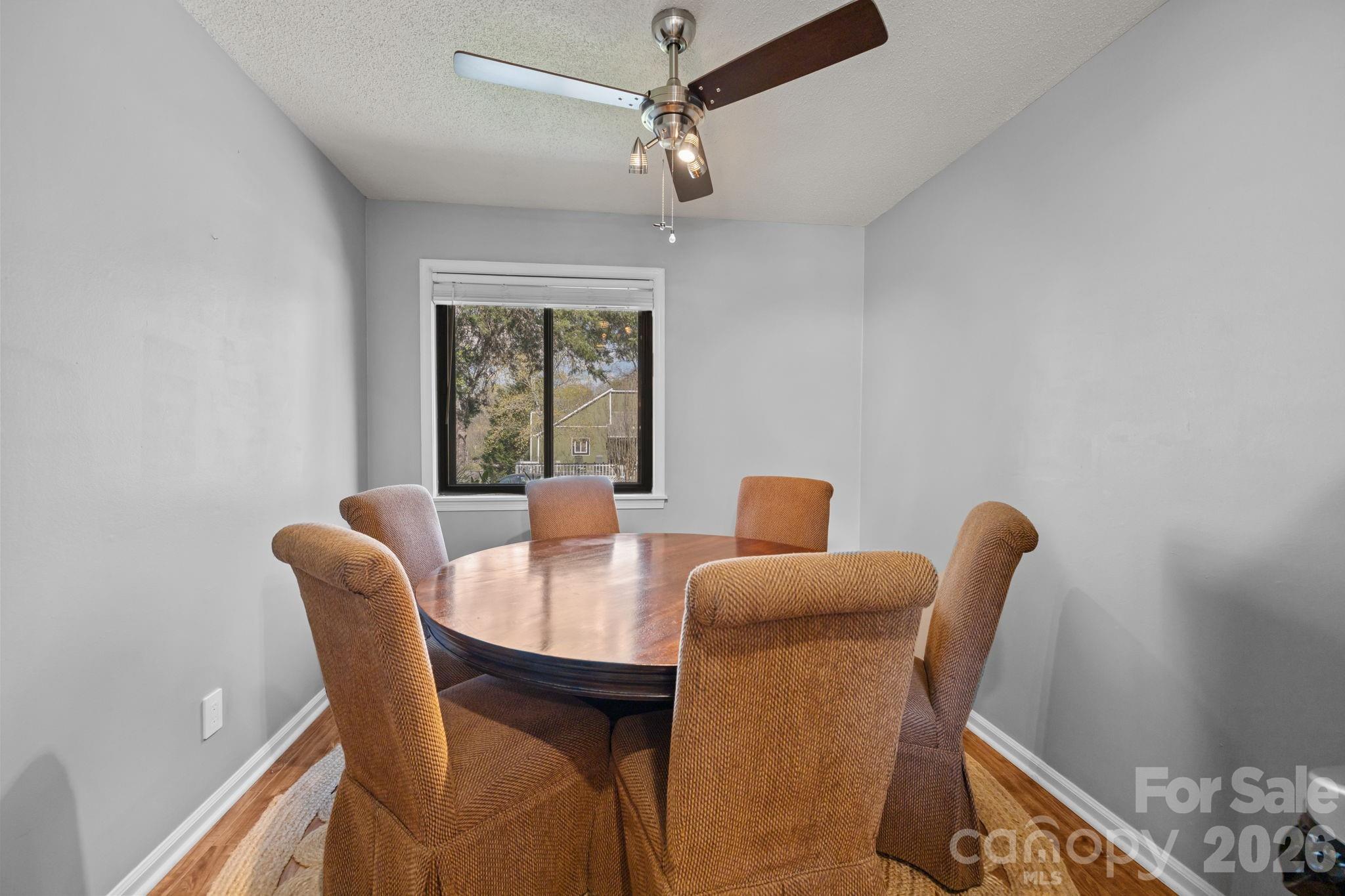 9067 Tulagi Court Fort Mill, SC 29708 - Photo 21 of 44 a dining room with furniture and window