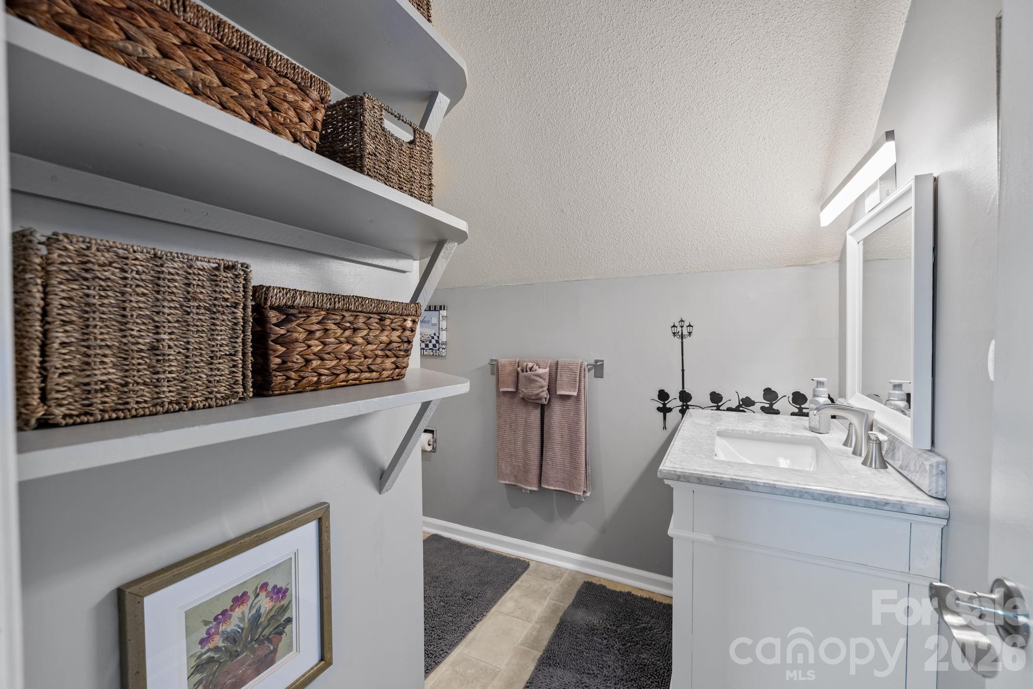 9067 Tulagi Court Fort Mill, SC 29708 - Photo 27 of 44 a bathroom with a sink and a mirror