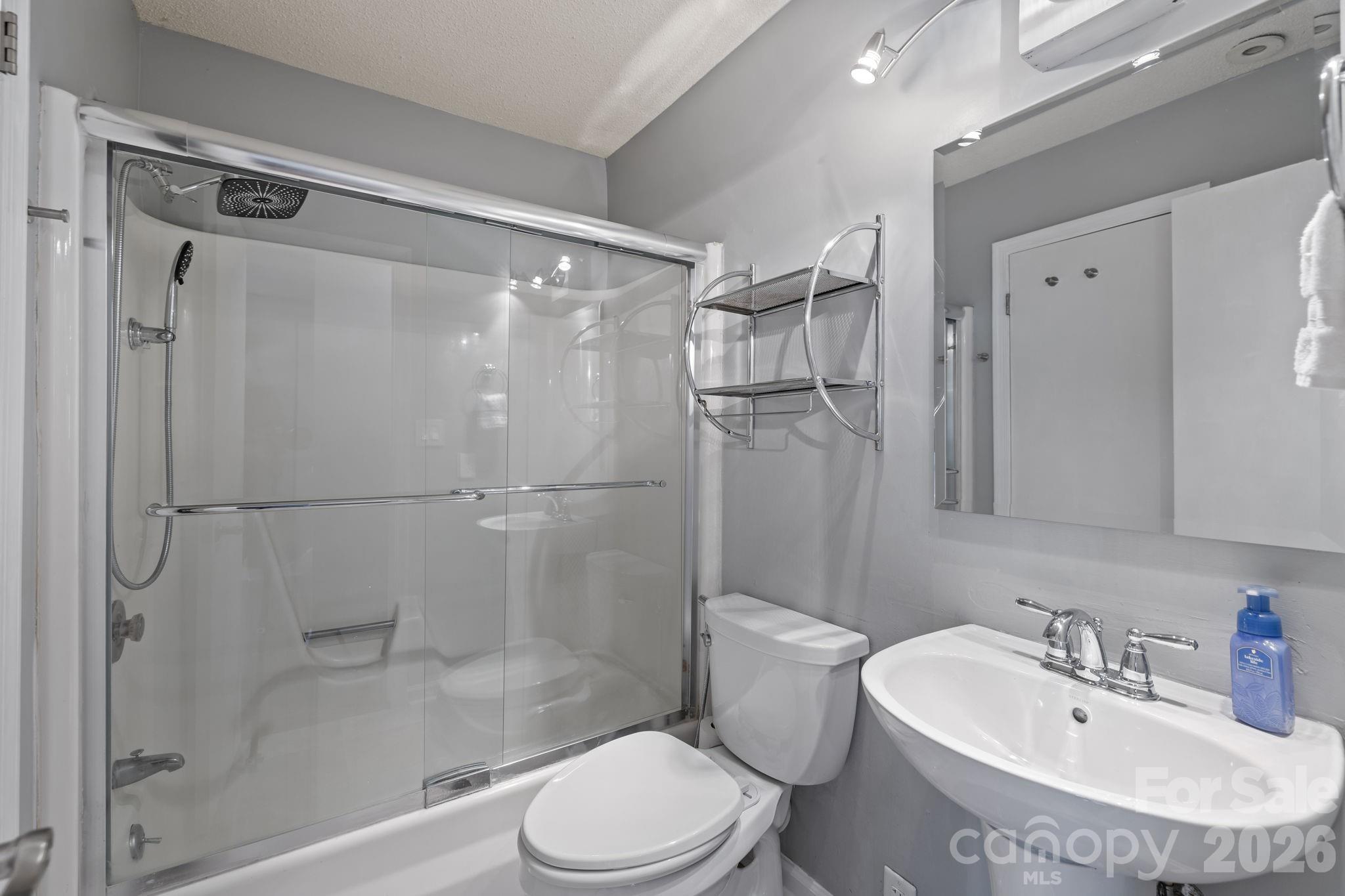 9067 Tulagi Court Fort Mill, SC 29708 - Photo 28 of 44 a bathroom with a sink toilet and shower