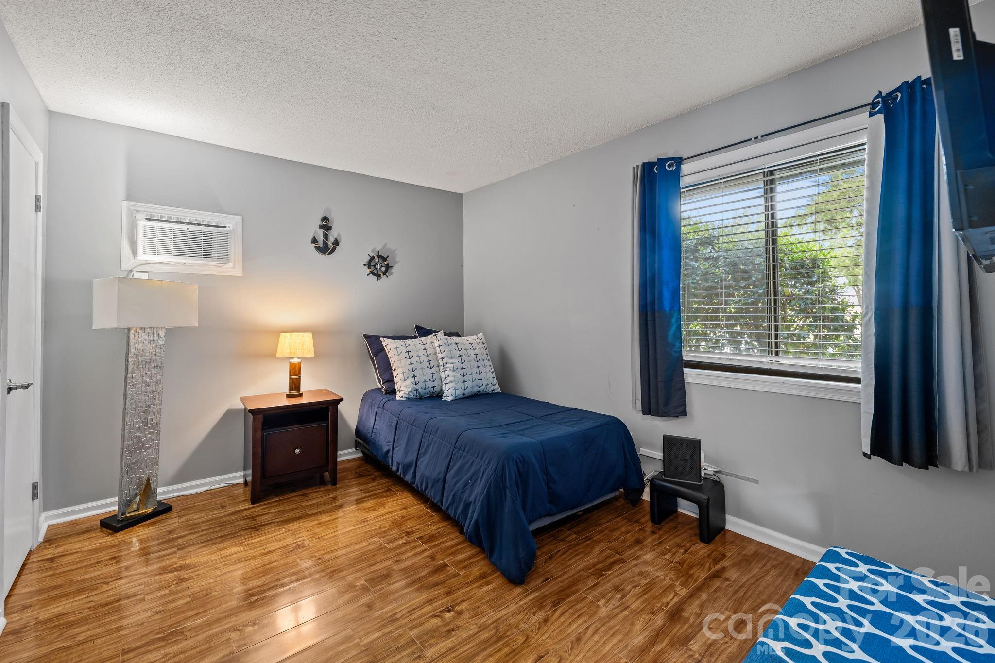 9067 Tulagi Court Fort Mill, SC 29708 - Photo 29 of 44 a bedroom with a bed and a window