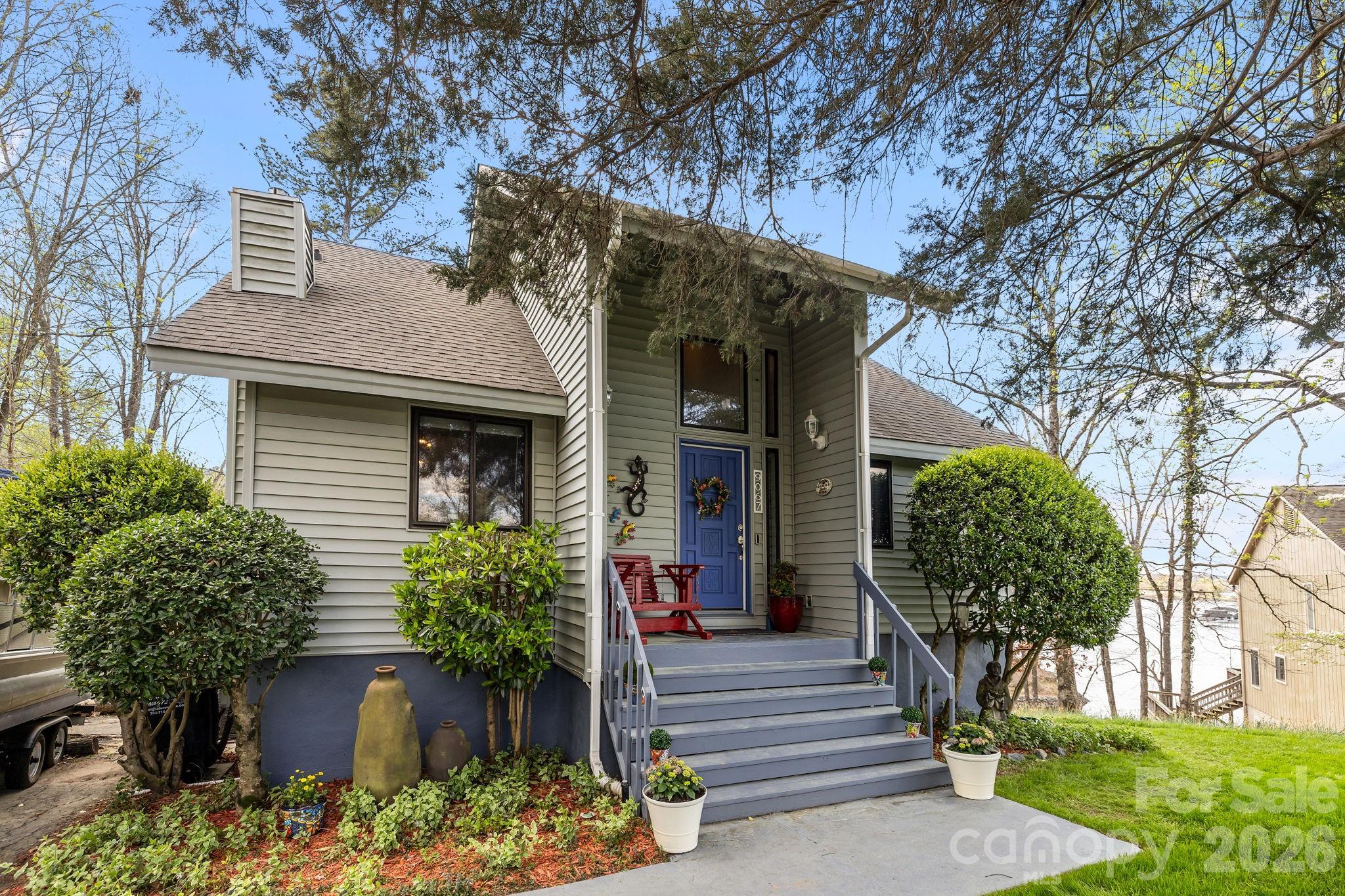 9067 Tulagi Court Fort Mill, SC 29708 - Photo 3 of 44 a front view of a house with garden