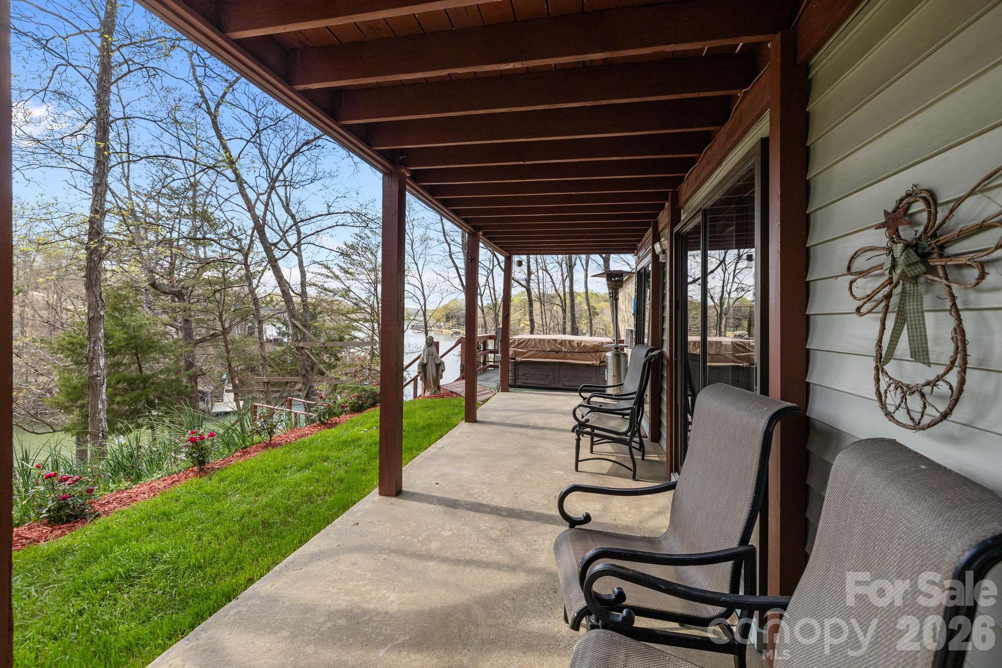 9067 Tulagi Court Fort Mill, SC 29708 - Photo 33 of 44 a view of a porch with chairs and backyard