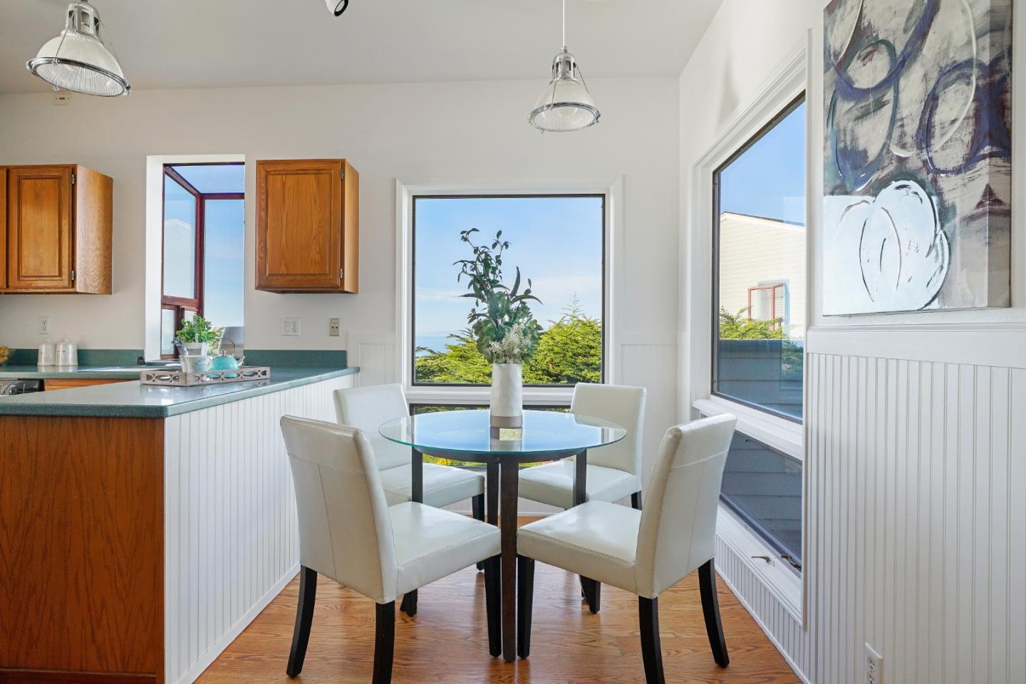215 Roberts Road Pacifica, CA 94044 - Photo 13 of 40 a view of a dining room with furniture and a chandelier