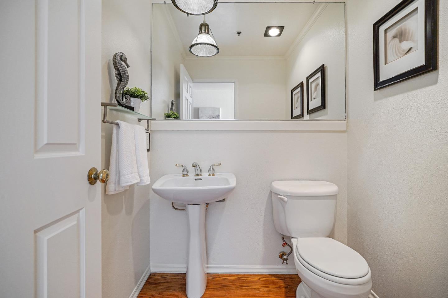 215 Roberts Road Pacifica, CA 94044 - Photo 14 of 40 a bathroom with a toilet sink and mirror