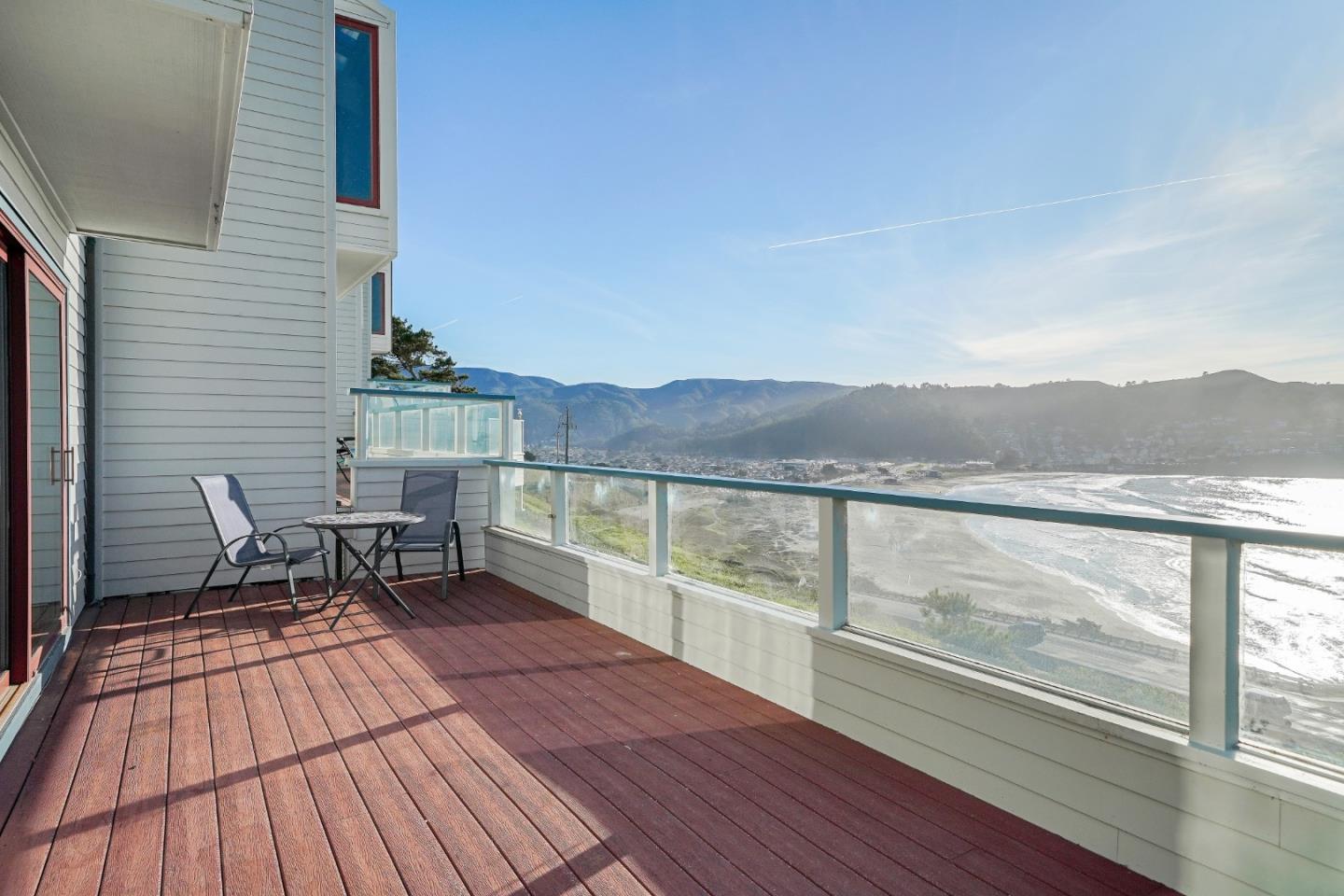 215 Roberts Road Pacifica, CA 94044 - Photo 17 of 40 a view of a balcony with chairs and wooden floor