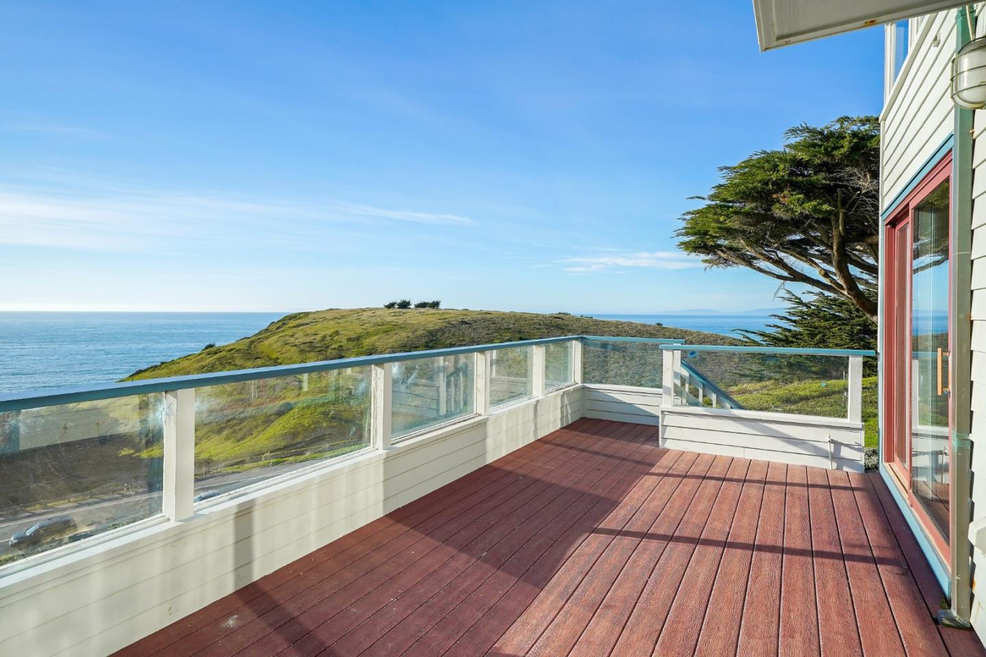 215 Roberts Road Pacifica, CA 94044 - Photo 18 of 40 a view of a balcony with wooden floor