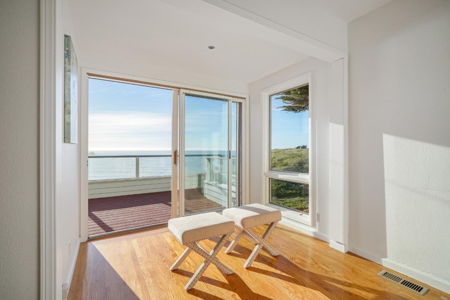 215 Roberts Road Pacifica, CA 94044 - Photo 20 of 40 a bed sitting in a bedroom next to a window