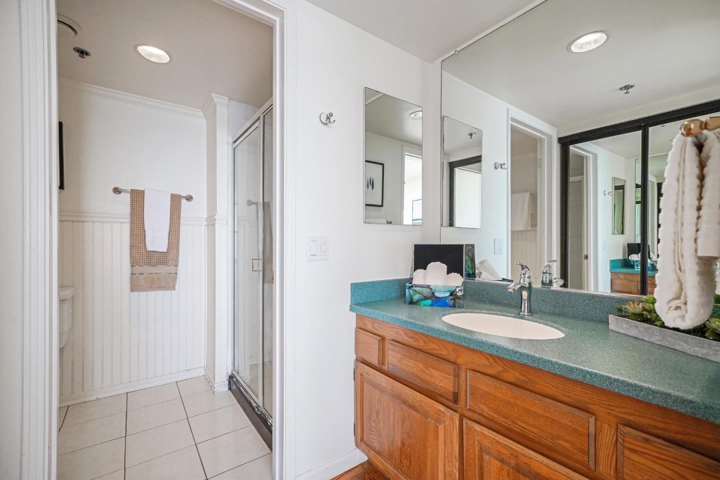 215 Roberts Road Pacifica, CA 94044 - Photo 21 of 40 a bathroom with double vanity and a mirror
