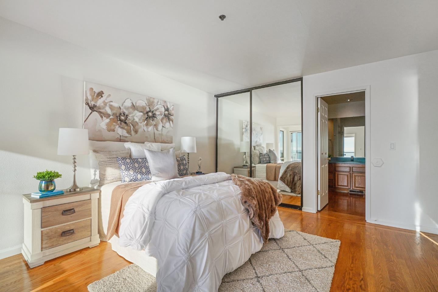 215 Roberts Road Pacifica, CA 94044 - Photo 23 of 40 a bedroom with a bed and a cabinets