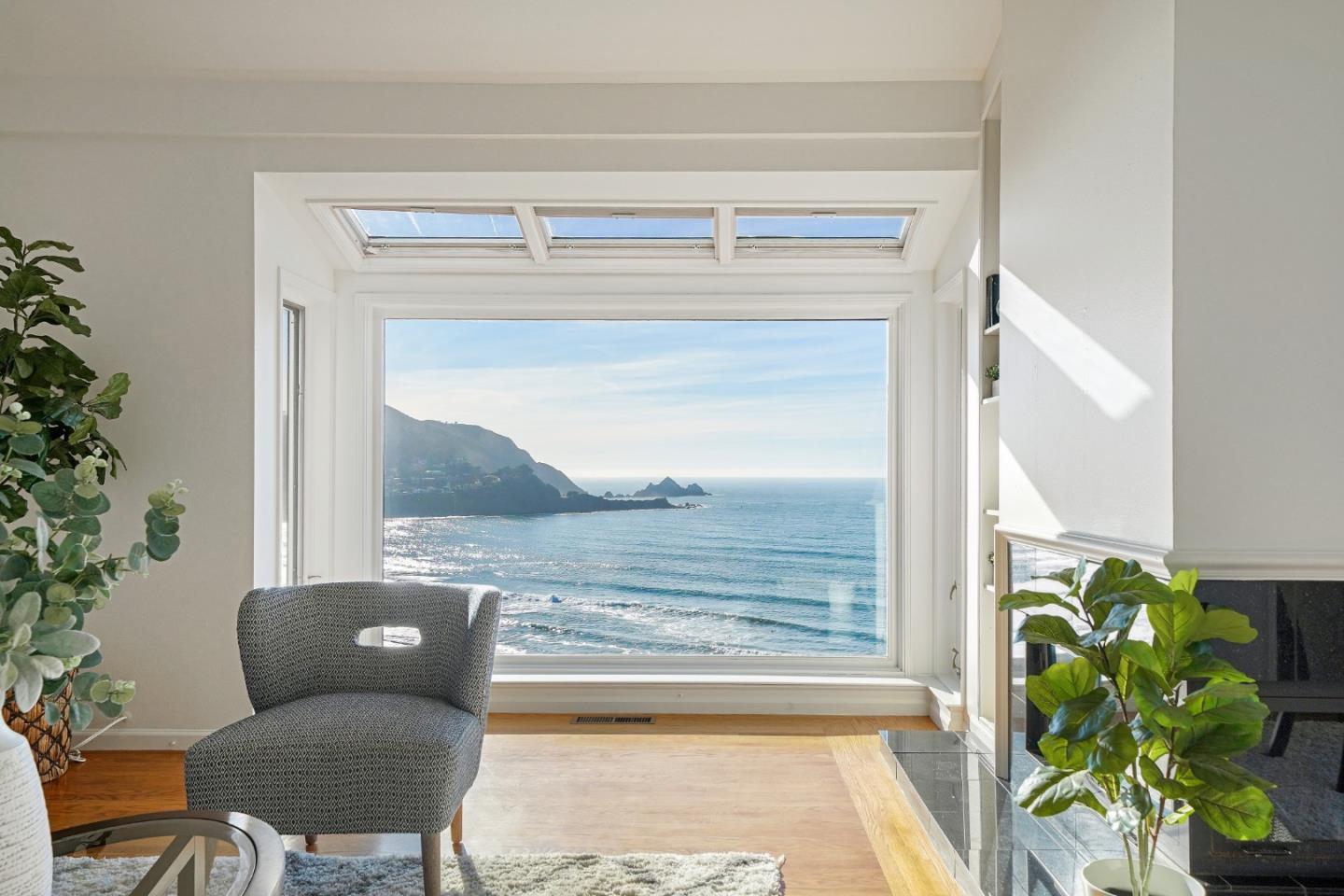 215 Roberts Road Pacifica, CA 94044 - Photo 3 of 40 a living room with a couch and a potted plant