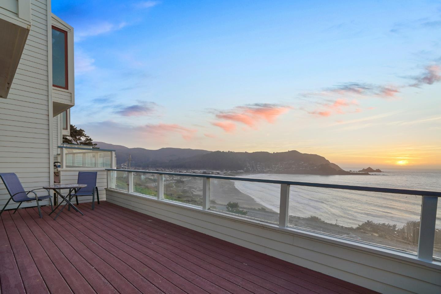 215 Roberts Road Pacifica, CA 94044 - Photo 38 of 40 a view of roof deck with table and chairs and wooden floor