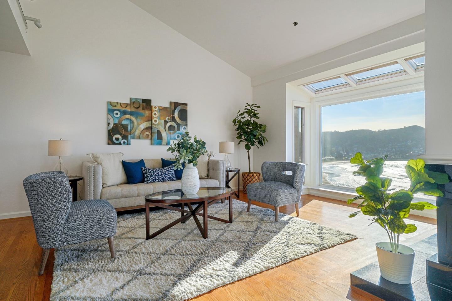 215 Roberts Road Pacifica, CA 94044 - Photo 4 of 40 a living room with furniture and a potted plant