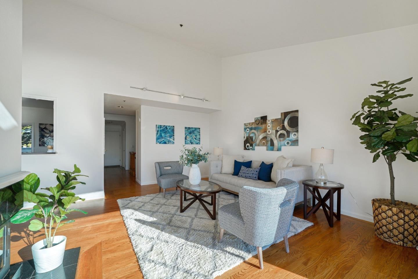 215 Roberts Road Pacifica, CA 94044 - Photo 5 of 40 a living room with furniture and a potted plant