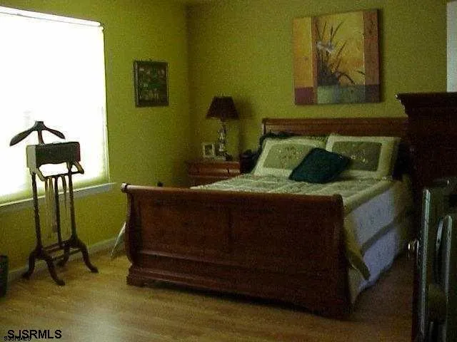 a bedroom with a bed and cabinets