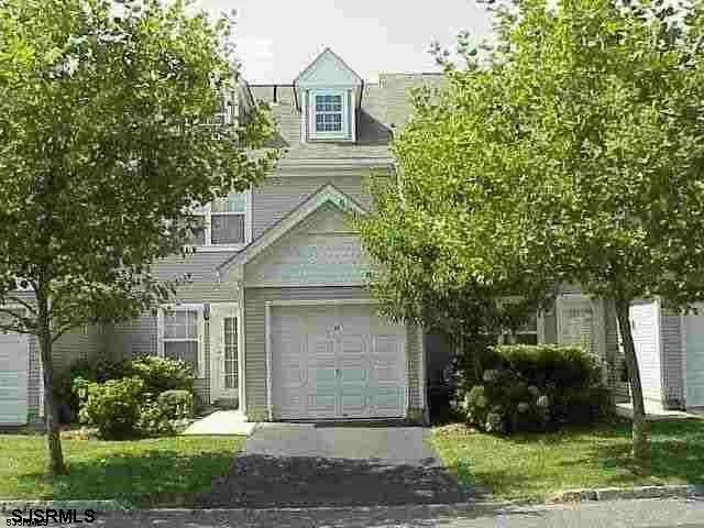 front view of a house and a yard