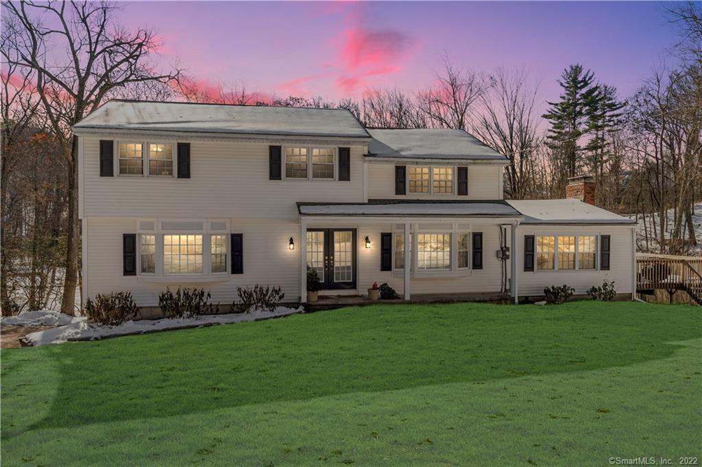9 Twixt Hills Road Ridgefield, CT 06877 - Photo 1 of 1 a front view of a house with a garden