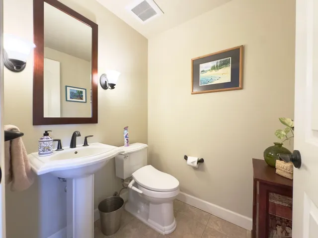 a bathroom with a tub a sink and a shower