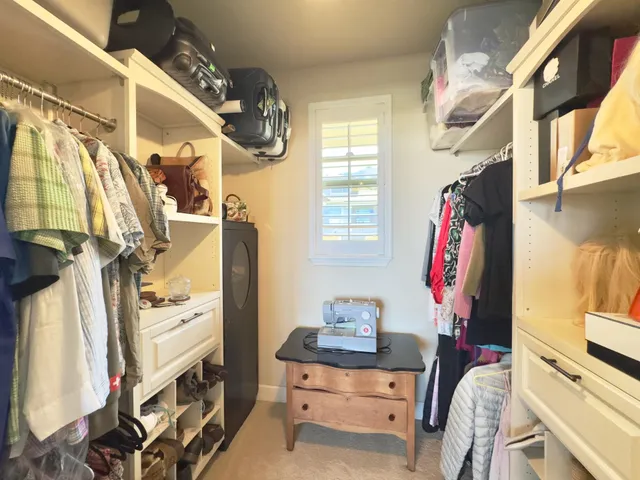 a bedroom with a bed and dresser