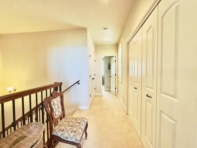 a bedroom with furniture and a window