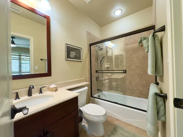 a view of a hallway with wooden floor and stairs