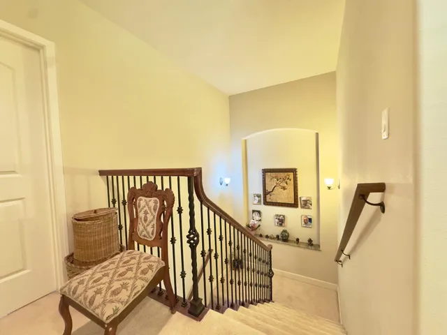 a view of a chairs and table in the balcony