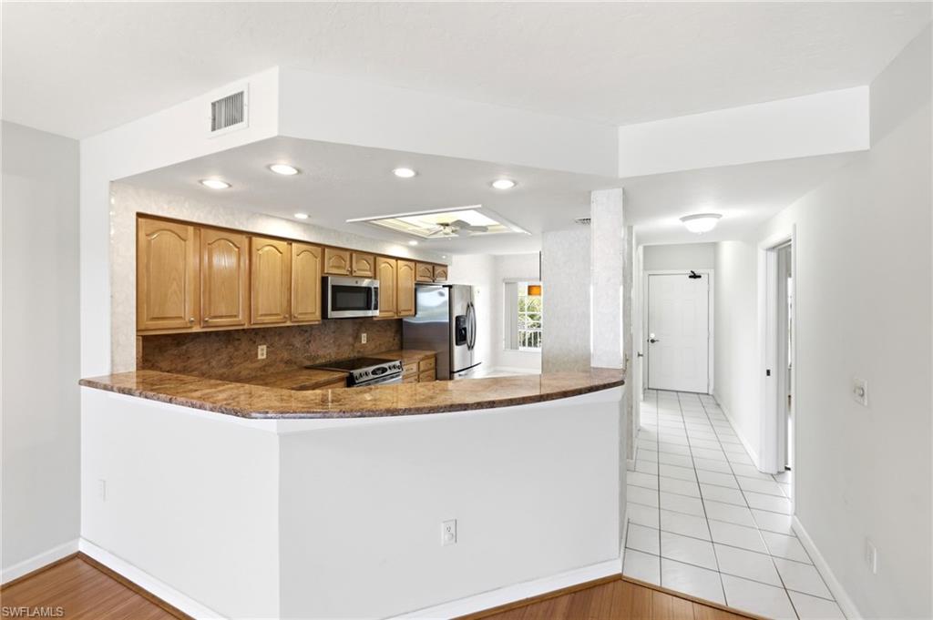 13105 Vanderbilt Drive, Unit 407 Naples, FL 34110 - Photo 7 of 38
