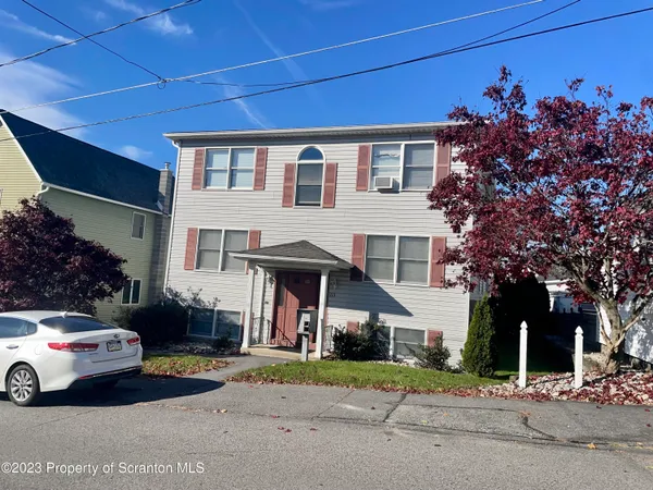 a car parked in front of a house