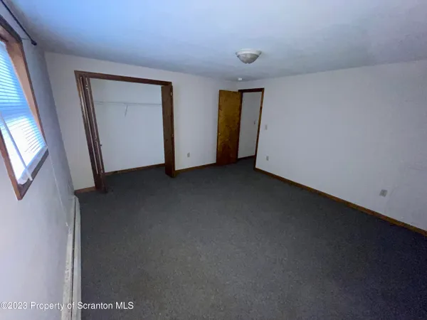 a bathroom with a sink toilet and mirror