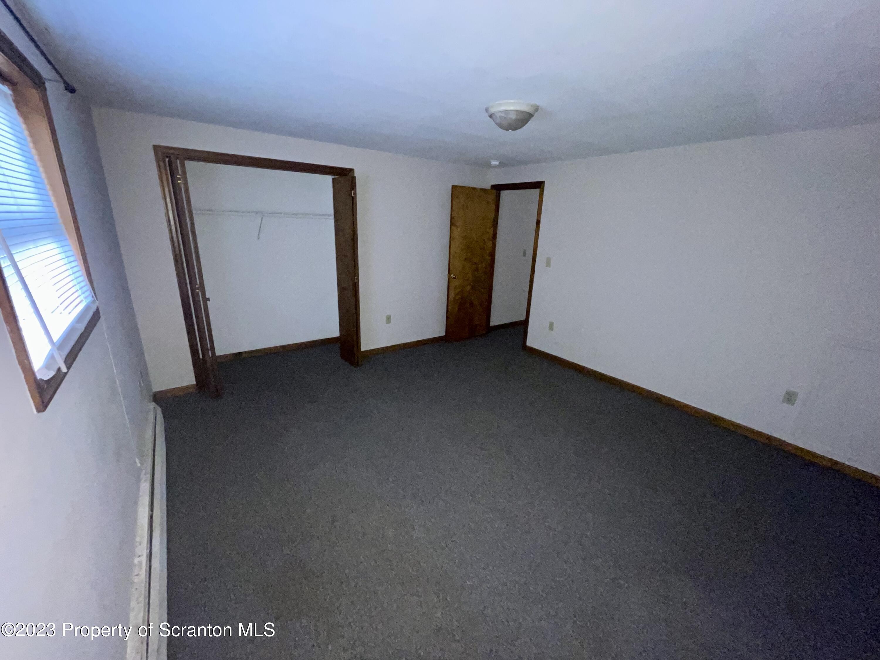 113 Frank Street, Unit 1 Dunmore, PA 18512 - Photo 7 of 9 a view of an empty room with a window