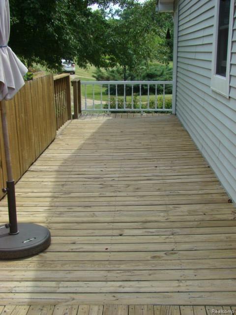 4214 Stanley Road Columbiaville, MI 48421 - Photo 28 of 46 side_wrap_of_deck.jpg