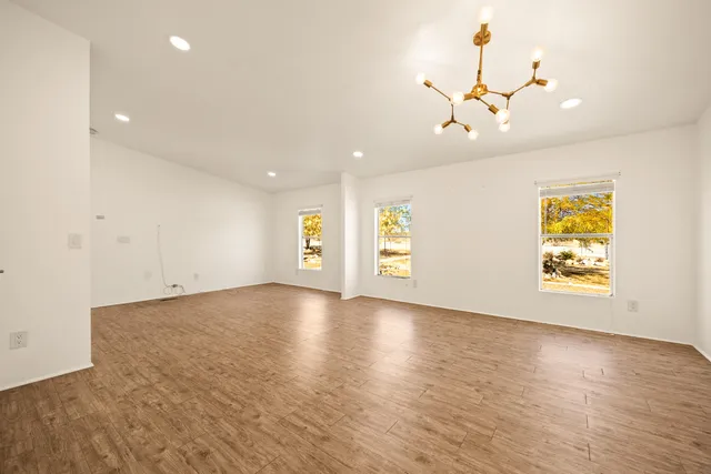 a view of a yard with snow on the road