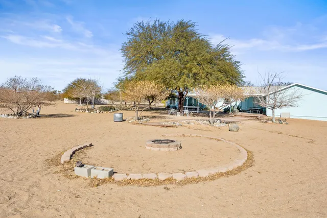 an outdoor sitting area with a table and chairs