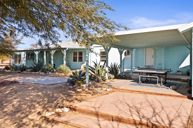 a outdoor space with lots of furniture and a rug
