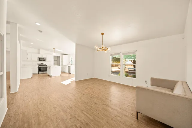 a view of a kitchen with a sink and a stove