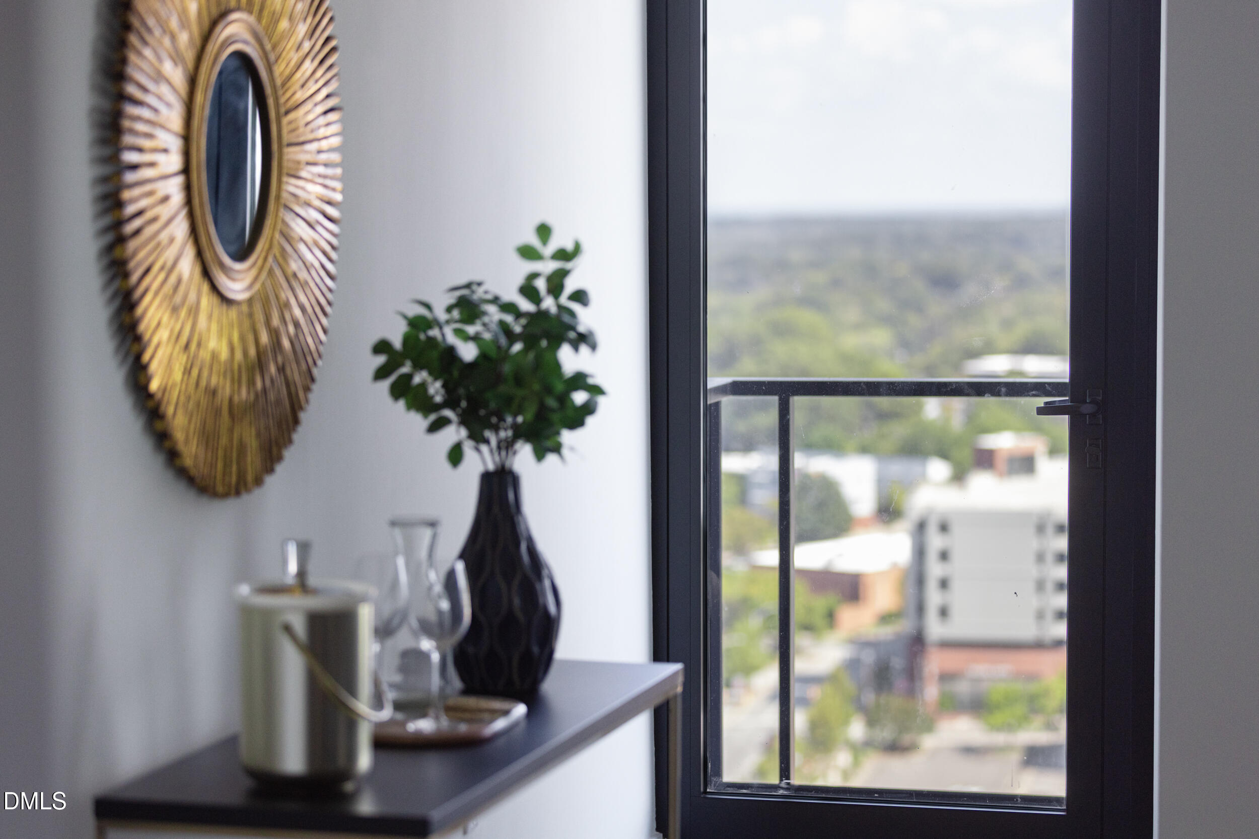 115 Morris Street, Unit 1903 Durham, NC 27701 - Photo 14 of 68 a vase of flowers sitting on a table next to a window