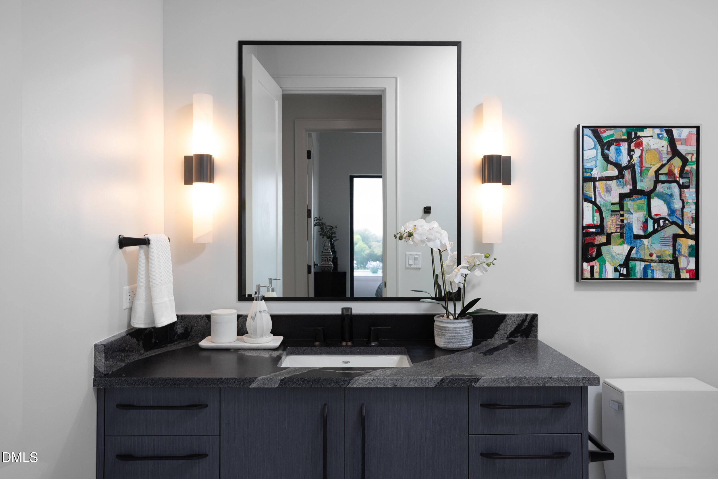 115 Morris Street, Unit 1903 Durham, NC 27701 - Photo 19 of 68 a bathroom with a sink and a mirror