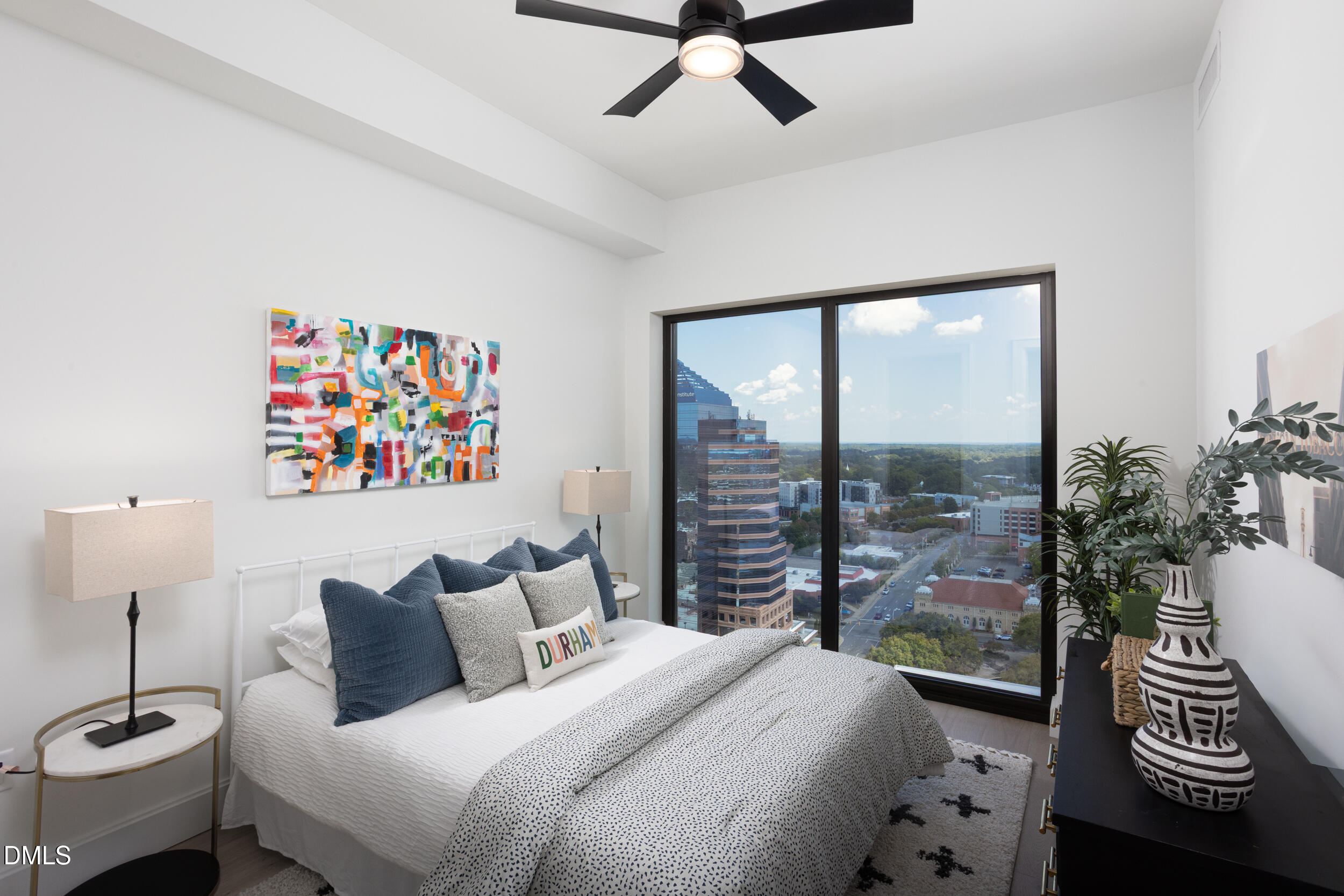 115 Morris Street, Unit 1903 Durham, NC 27701 - Photo 21 of 68 a bedroom with a bed and a large window