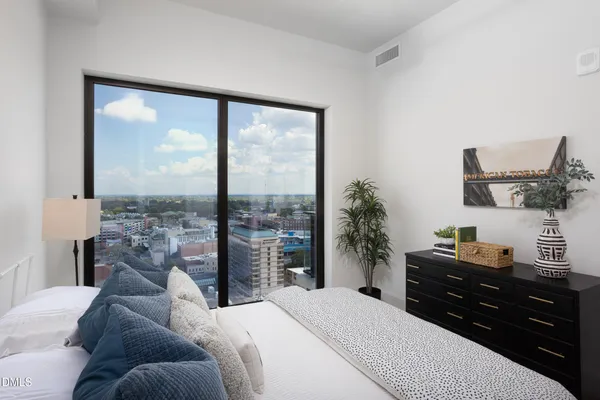 a view of a roof deck with furniture
