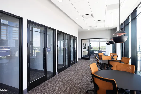 a view of a patio with couches chairs and a yard