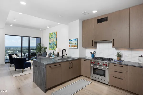 a kitchen with refrigerator and cabinets
