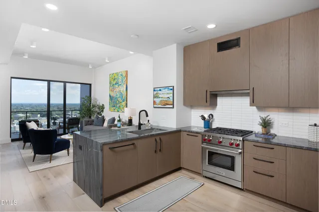 a kitchen with refrigerator and cabinets