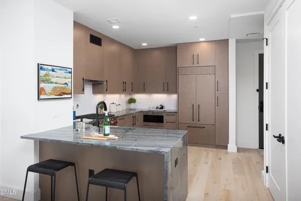 a white stove top oven sitting inside of a kitchen