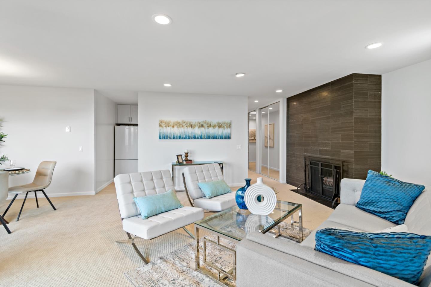 340 Vallejo Drive, Unit 53 Millbrae, CA 94030 - Photo 17 of 50 a living room with furniture and a fireplace