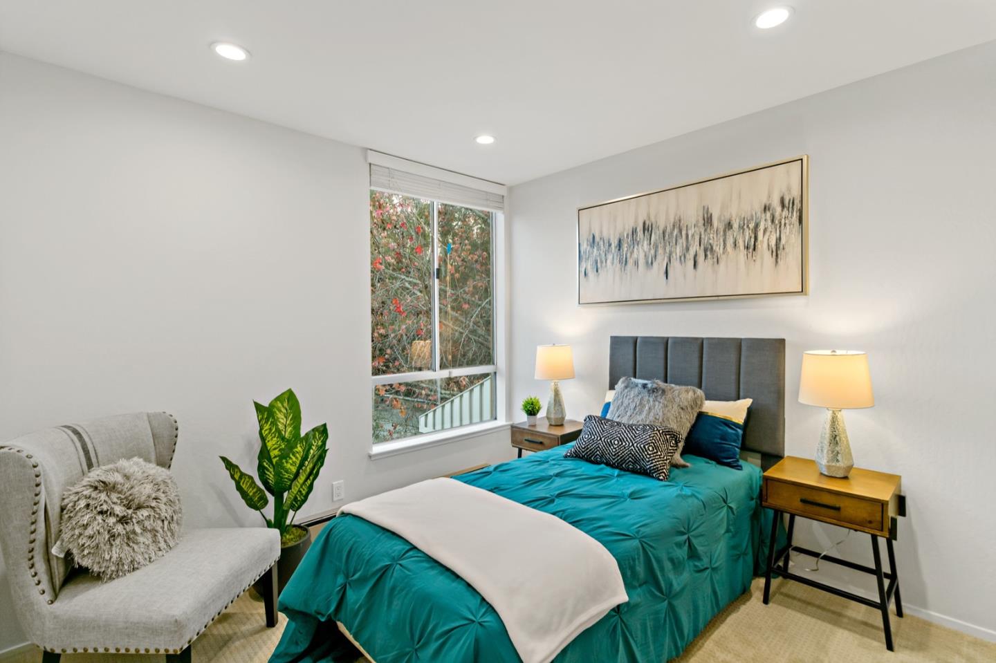 340 Vallejo Drive, Unit 53 Millbrae, CA 94030 - Photo 37 of 50 a bedroom with a bed and a painting on the wall