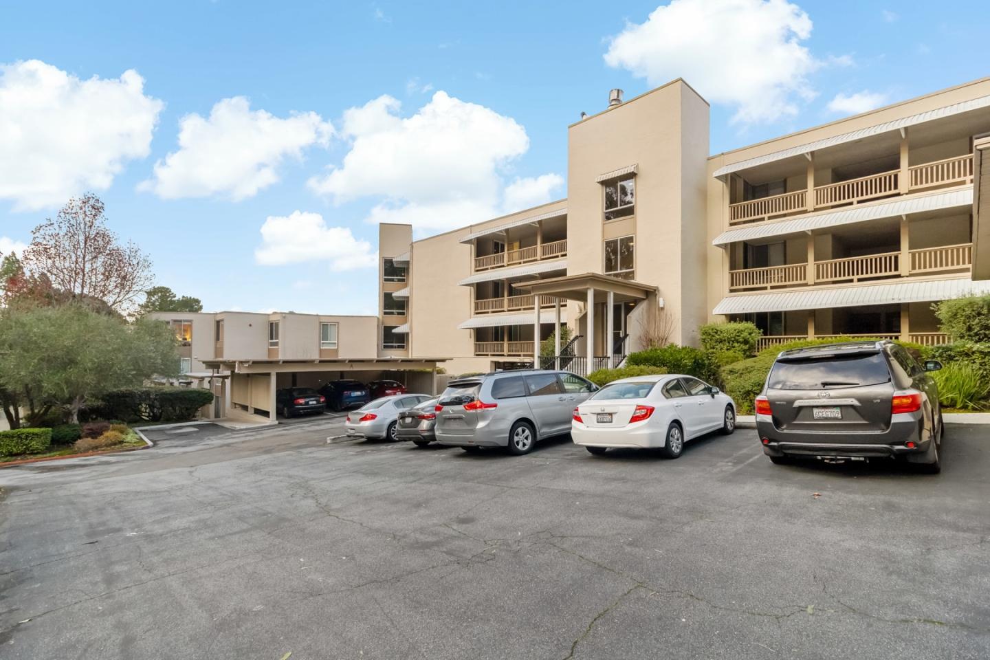 340 Vallejo Drive, Unit 53 Millbrae, CA 94030 - Photo 4 of 50 a view of cars parked in front of a building