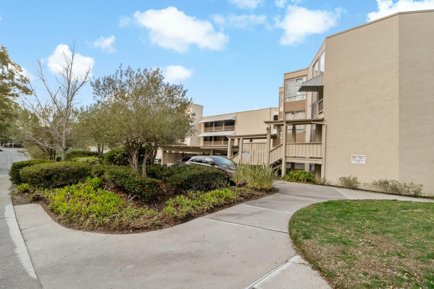 340 Vallejo Drive, Unit 53 Millbrae, CA 94030 - Photo 50 of 50 a view of a house with a small yard plants and trees