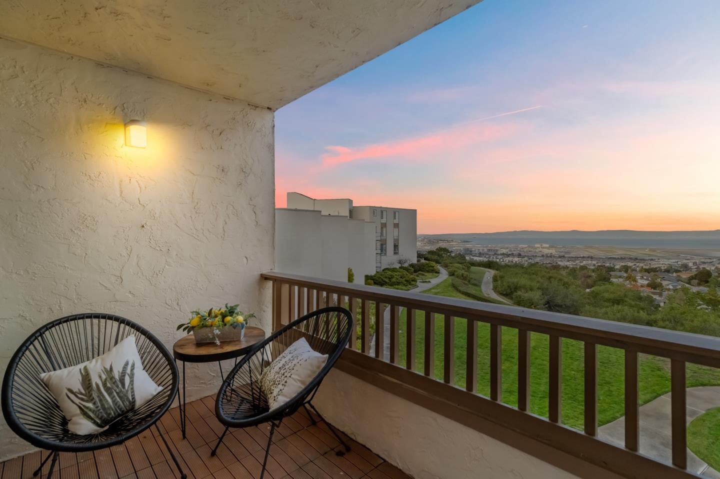 340 Vallejo Drive, Unit 53 Millbrae, CA 94030 - Photo 5 of 50 a view of a balcony with two chairs and a swing