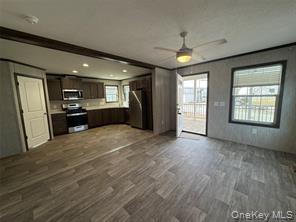 2898 Rte 9W New Windsor, NY 12553 - Photo 3 of 14 a view of an empty room with kitchen and a window