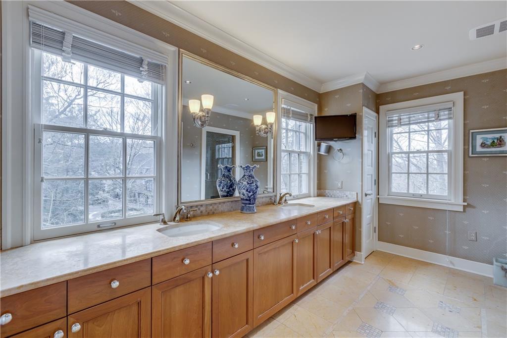 95 Woodland Road Pittsburgh, PA 15232 - Photo 17 of 25 The en suite master bathroom features his and hers sinks, an oversized walk-in shower, a private enclosed commode area, and TONS of storage space!