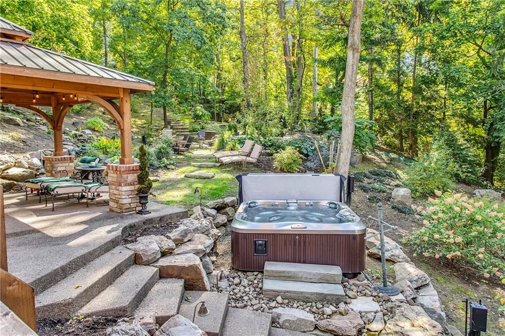 95 Woodland Road Pittsburgh, PA 15232 - Photo 23 of 25 Slip into the hot tub after you have spent a little time dining or watching TV in the outdoor pavilion...At night time, cozy up to the ever-ready fire, at the electronically ignited gas fire pit!